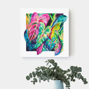 Colorful elephant ear canvas art hangs on a white wall